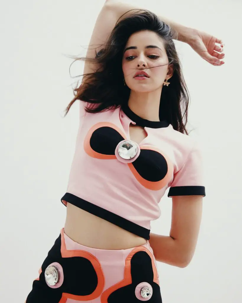 Ananya Panday posing in pink and black outfit.